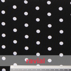 Tejido tipo crepón estampado con lunares de 0,80 cm.